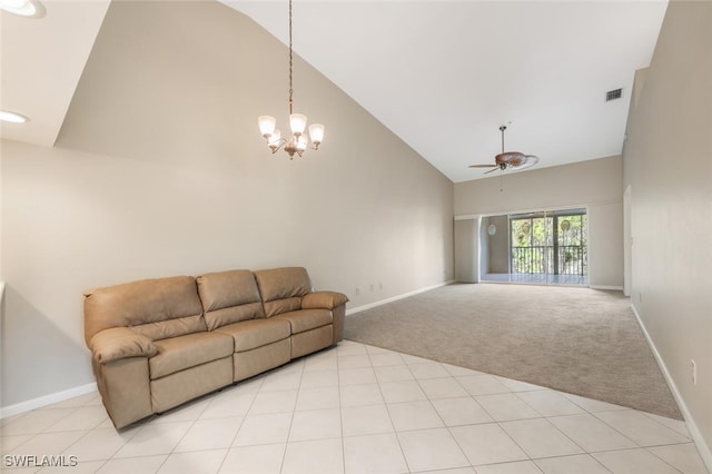 living room with ceiling fan with notable chandelier, high vaulted ceiling, and light carpet