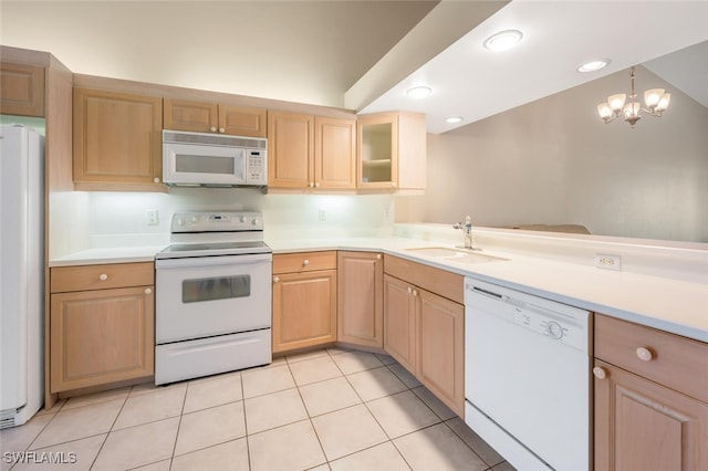 kitchen with white appliances, a chandelier, light tile patterned floors, light brown cabinetry, and sink