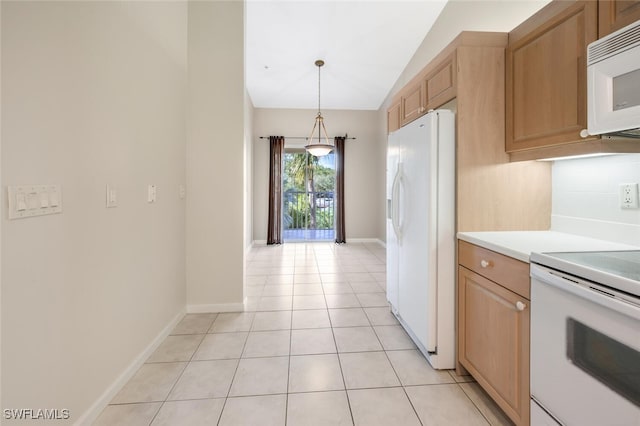 kitchen featuring white appliances, vaulted ceiling, pendant lighting, light tile patterned floors, and backsplash