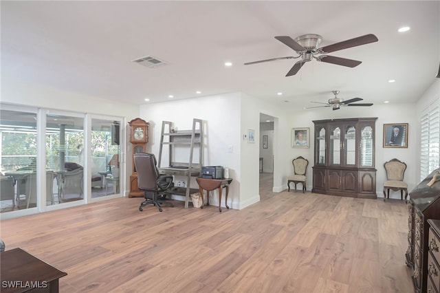 office area featuring ceiling fan, a healthy amount of sunlight, and light wood-type flooring