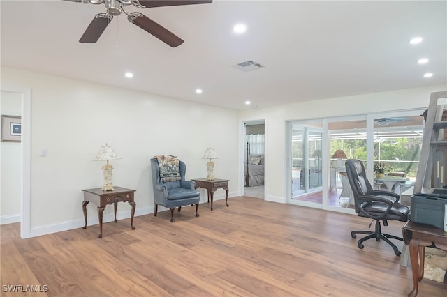 office featuring light hardwood / wood-style floors and ceiling fan