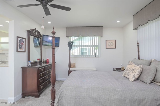 bedroom with ceiling fan and light colored carpet