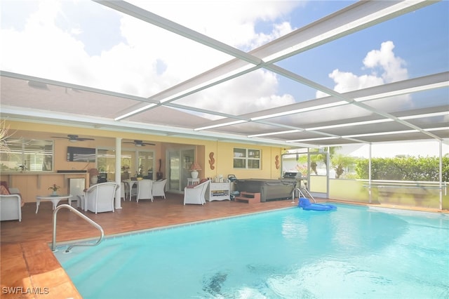 view of pool featuring a lanai, a patio, and a hot tub