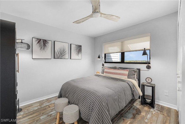 bedroom featuring dark hardwood / wood-style floors and ceiling fan