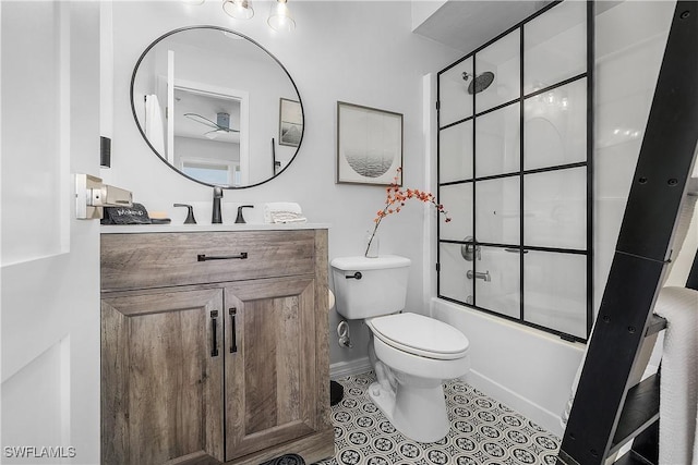 full bathroom with tile patterned floors, vanity, bath / shower combo with glass door, and toilet