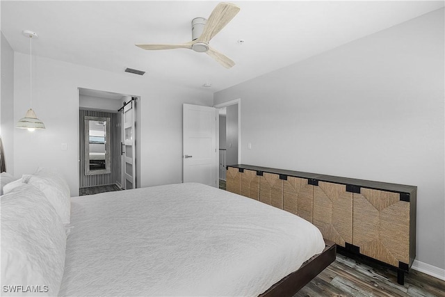 bedroom featuring ceiling fan and dark hardwood / wood-style floors