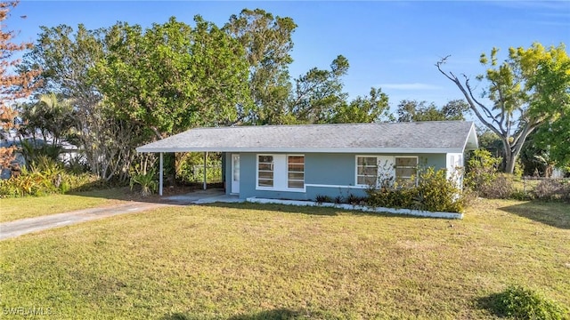 ranch-style home with a front lawn and a carport