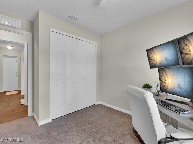 home office with carpet flooring