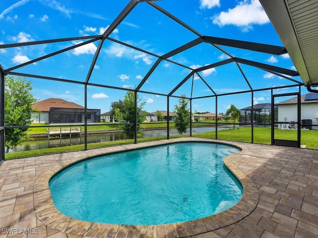 view of pool with a water view, glass enclosure, a patio area, and a lawn