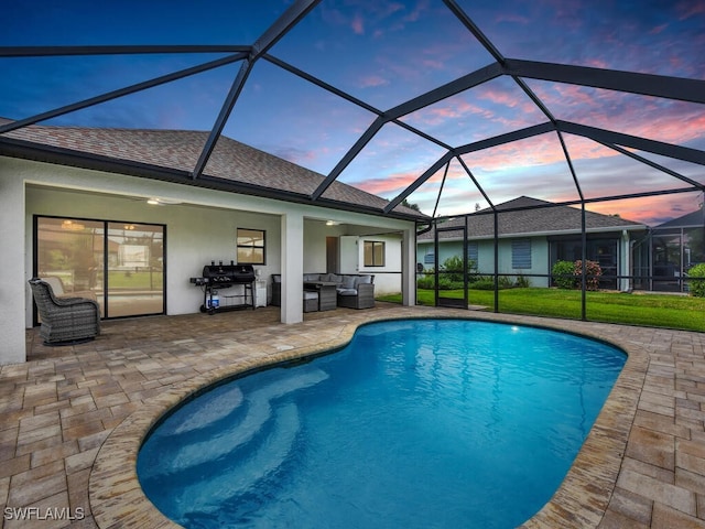 pool at dusk featuring a patio area, an outdoor living space, and glass enclosure