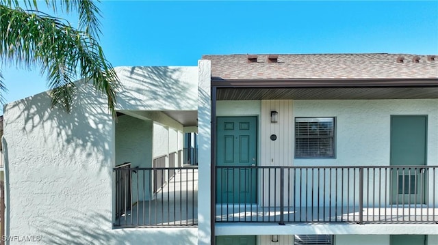 doorway to property featuring a balcony