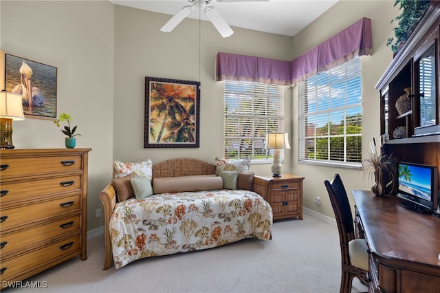 bedroom with light carpet and ceiling fan