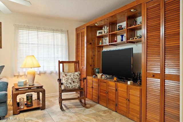 sitting room featuring light tile patterned floors