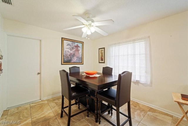 dining room featuring ceiling fan