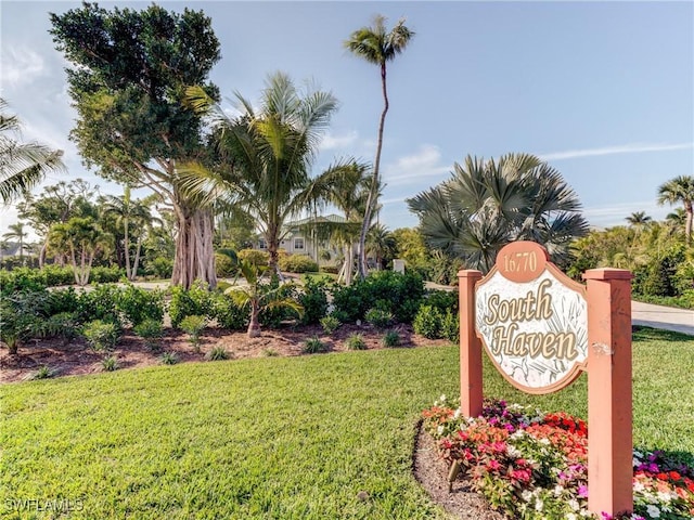 community / neighborhood sign with a lawn