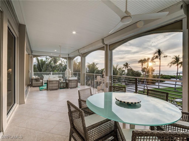 patio terrace at dusk featuring outdoor dining space