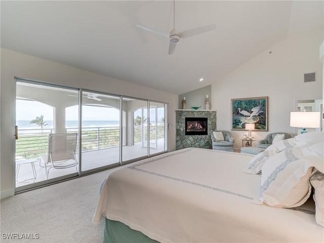 bedroom featuring ceiling fan, access to exterior, vaulted ceiling, carpet flooring, and a water view