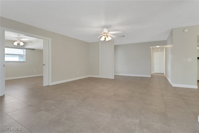 empty room with light tile patterned flooring and ceiling fan