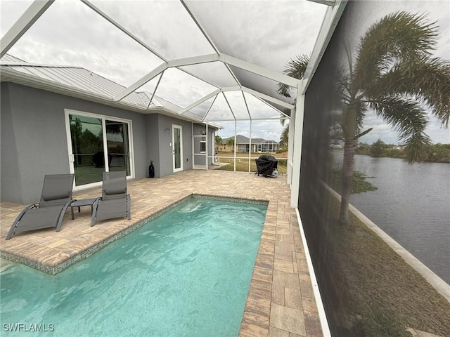 view of swimming pool with a patio and a lanai