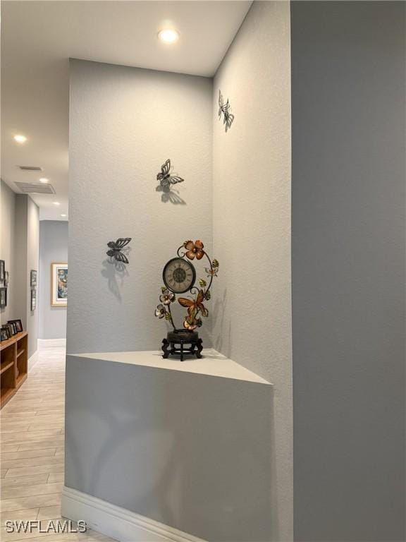 hallway with light wood-type flooring