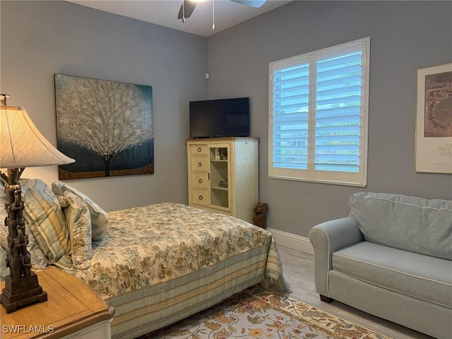 bedroom with hardwood / wood-style flooring and ceiling fan