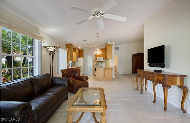 tiled living room featuring ceiling fan