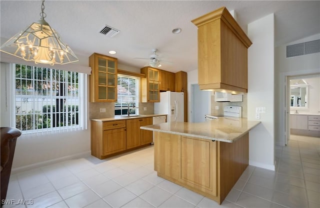 kitchen featuring pendant lighting, light tile patterned floors, white appliances, decorative backsplash, and kitchen peninsula