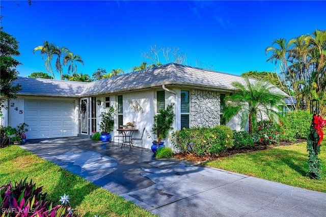 ranch-style house featuring a garage