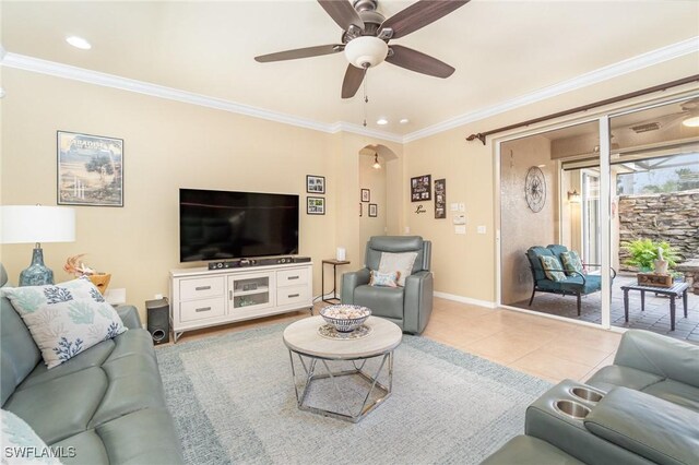 living room featuring crown molding, ceiling fan, and light tile patterned floors