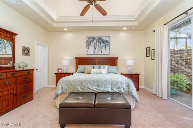 bedroom featuring access to outside, light colored carpet, ceiling fan, and a tray ceiling