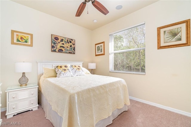 bedroom with ceiling fan and carpet flooring