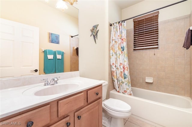 full bathroom featuring tile patterned flooring, vanity, shower / tub combo with curtain, and toilet