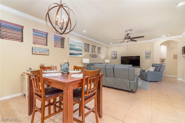 dining area featuring ornamental molding, ceiling fan with notable chandelier, and light tile patterned floors