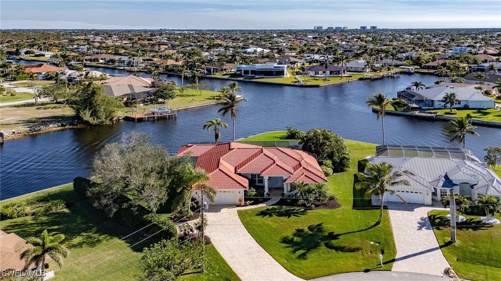 birds eye view of property featuring a water view