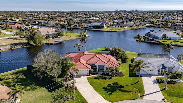 birds eye view of property featuring a water view