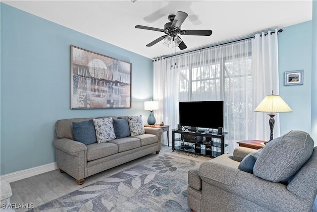 living room with ceiling fan and hardwood / wood-style floors