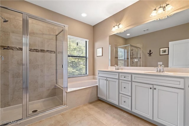 bathroom featuring separate shower and tub, tile patterned floors, and vanity