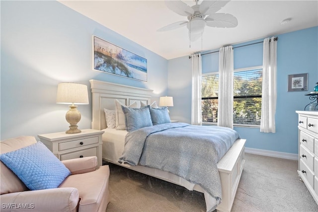 bedroom with ceiling fan and light carpet