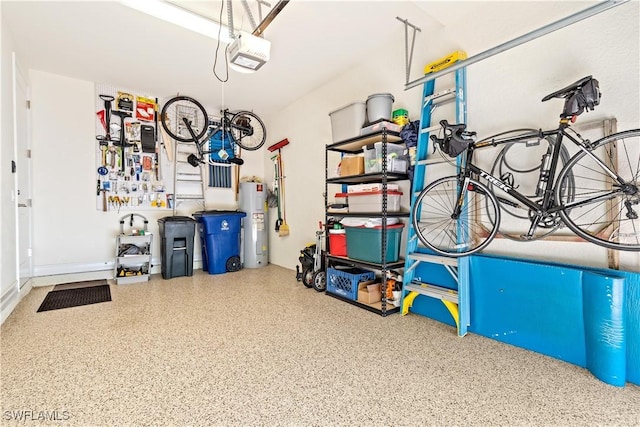 garage featuring electric water heater and a garage door opener