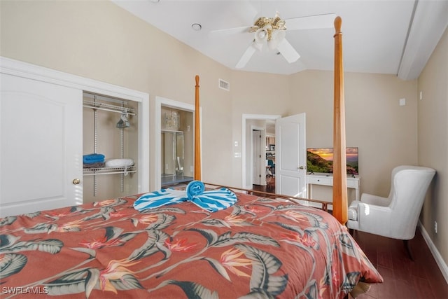 bedroom featuring dark hardwood / wood-style flooring, a closet, vaulted ceiling, and ceiling fan