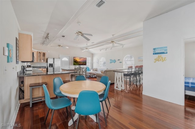 dining area with dark hardwood / wood-style floors, ceiling fan, lofted ceiling, and track lighting