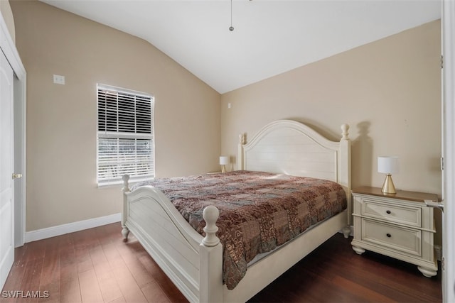 bedroom with dark hardwood / wood-style flooring and vaulted ceiling