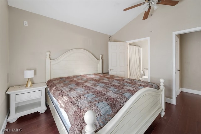 bedroom featuring ceiling fan, dark hardwood / wood-style floors, ensuite bathroom, and vaulted ceiling