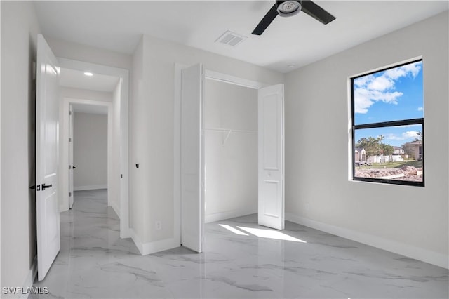 unfurnished bedroom with a closet and ceiling fan