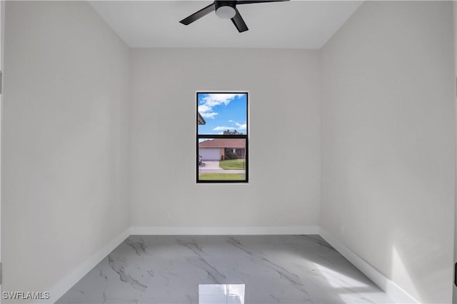 spare room with ceiling fan