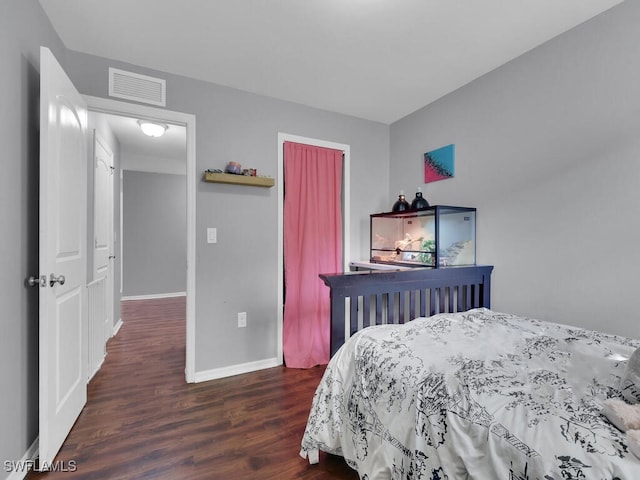 bedroom featuring dark hardwood / wood-style flooring