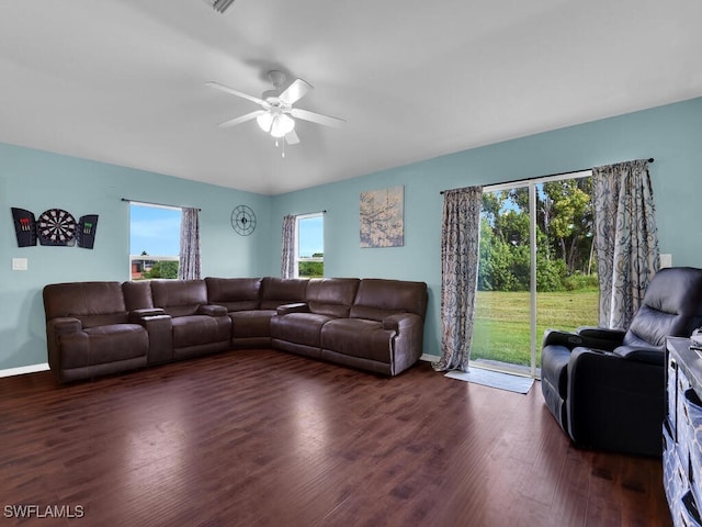 living room with ceiling fan and dark hardwood / wood-style floors