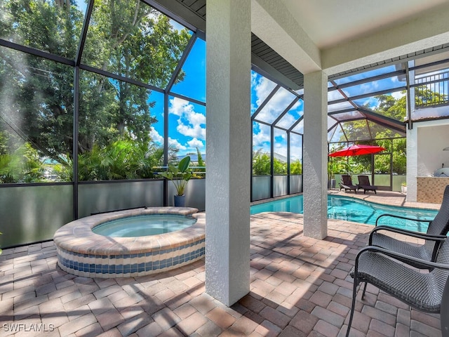 outdoor pool featuring a lanai, a patio, and an in ground hot tub