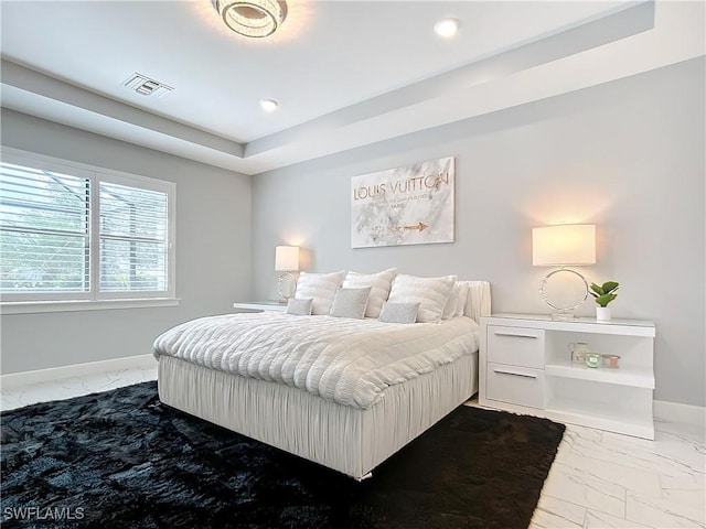 bedroom featuring a tray ceiling