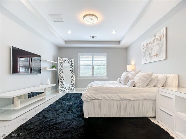 bedroom with a raised ceiling